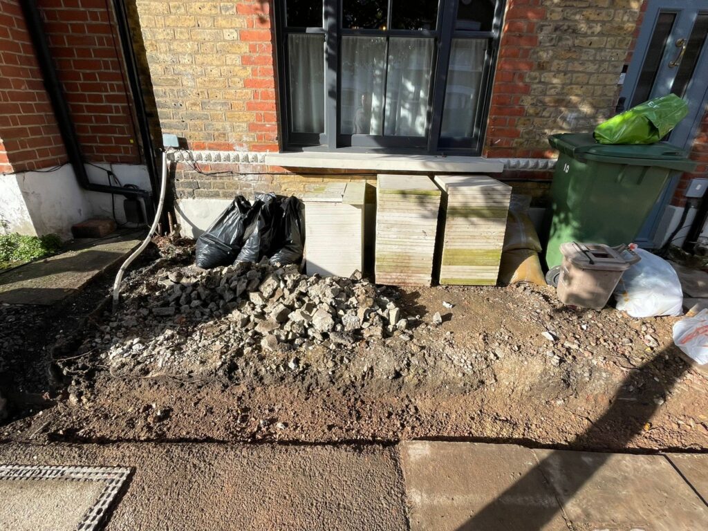 Demolition of the old front yard wall in Peckham SE15, London