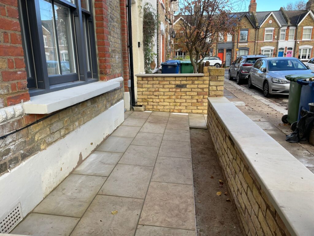 Near-completion of new front yard wall in Peckham SE15, London