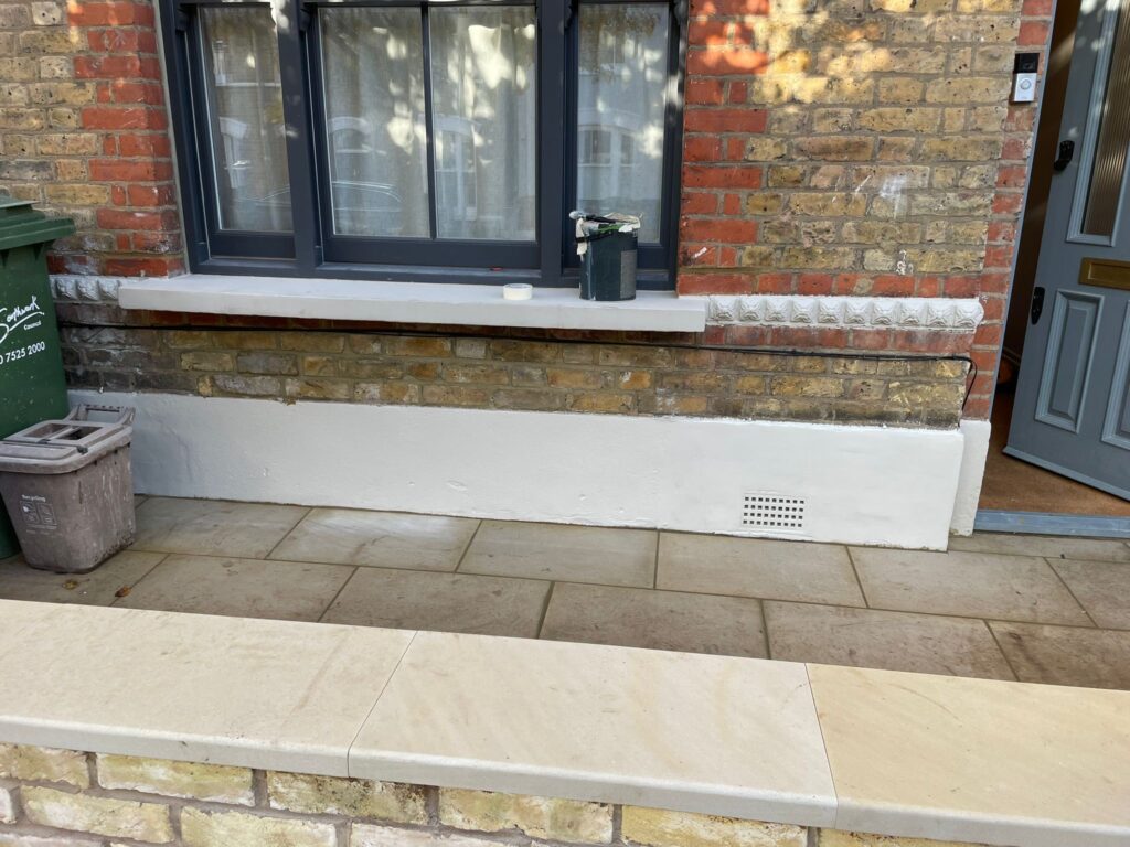 Half-built new front yard wall in Peckham SE15, London