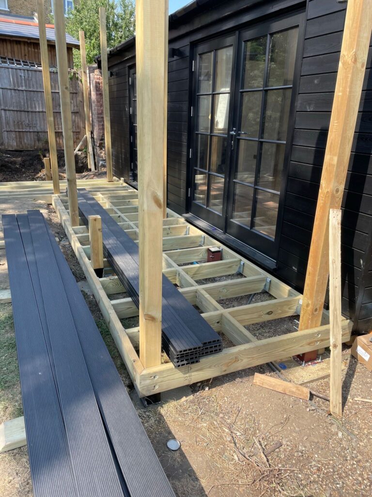 Installing decking boards on patio in West Norwood SE27, London